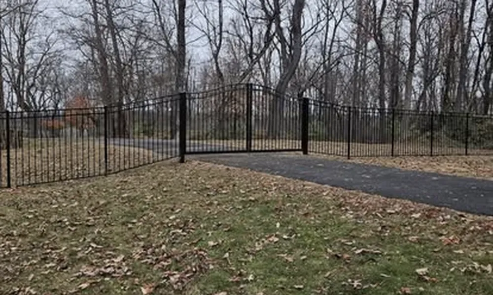 black-metal-fence-installation-in-winchester-with-trees-and-pathway