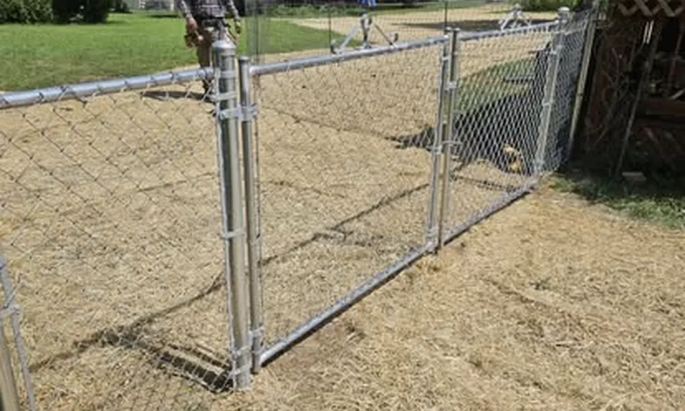 chain-link-fence-in-open-field-with-man-va-affordable