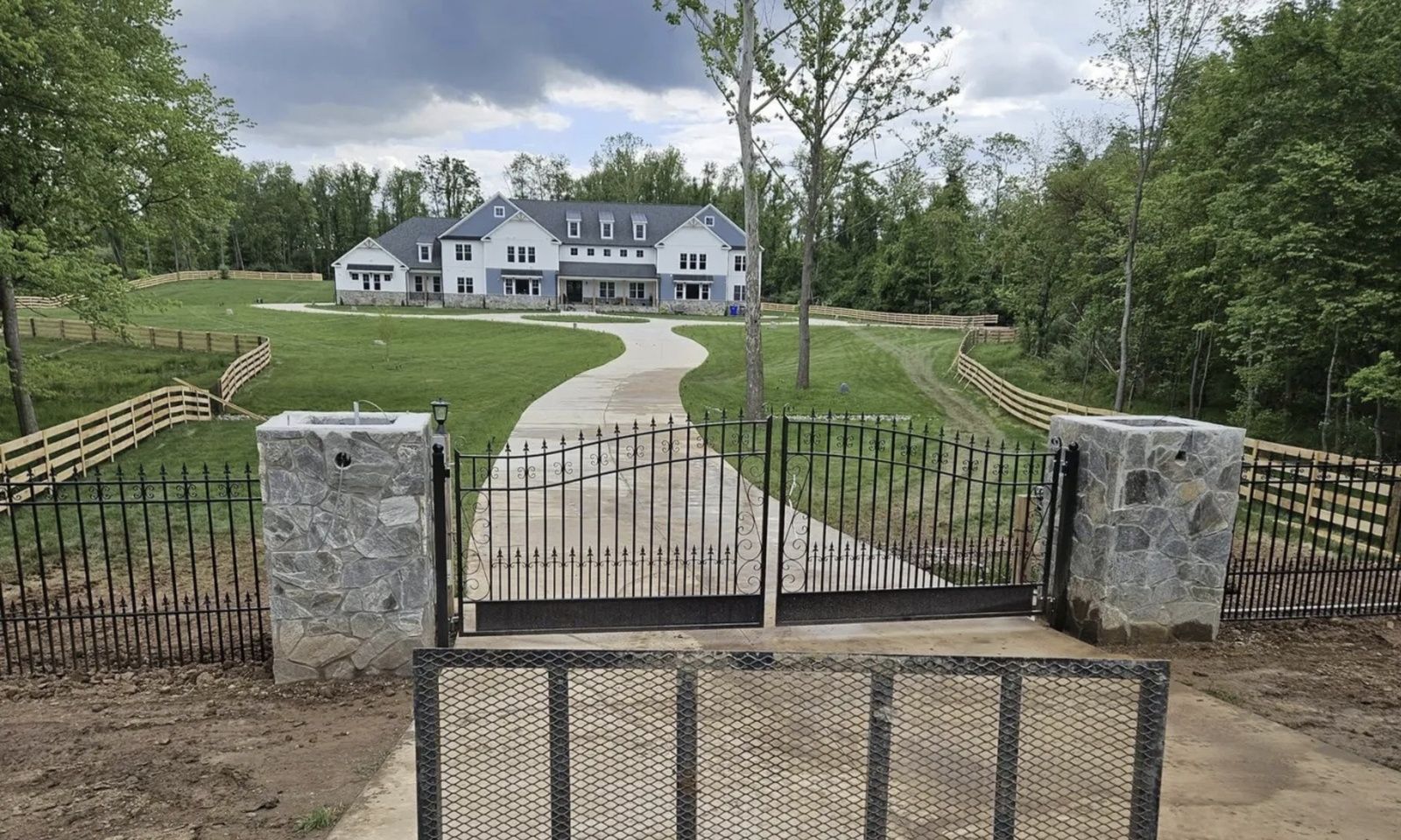 gated-entrance-to-house-on-rolling-landscape-in-va