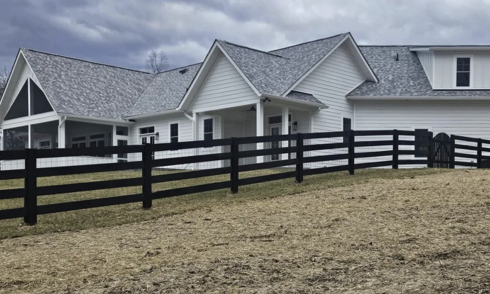 new-white-farmhouse-with-black-fence-va