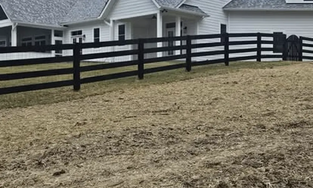 fenced-area-with-house-and-security-options-in-background