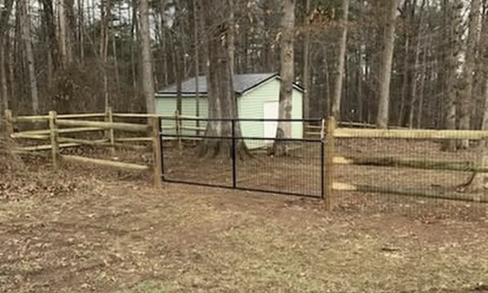 fenced-area-with-green-shed-in-woods-va-affordable