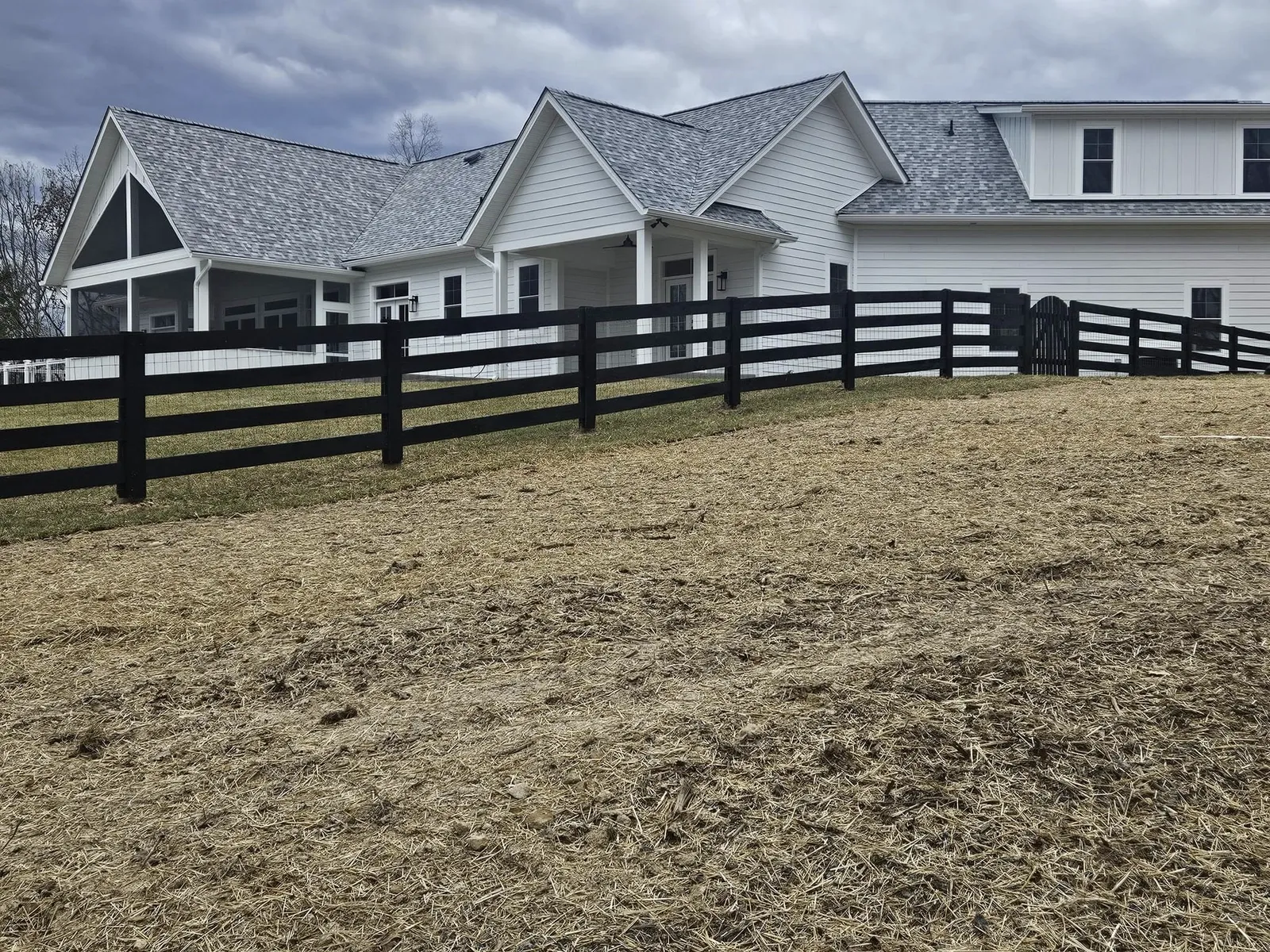 new-white-farmhouse-with-black-fence-va