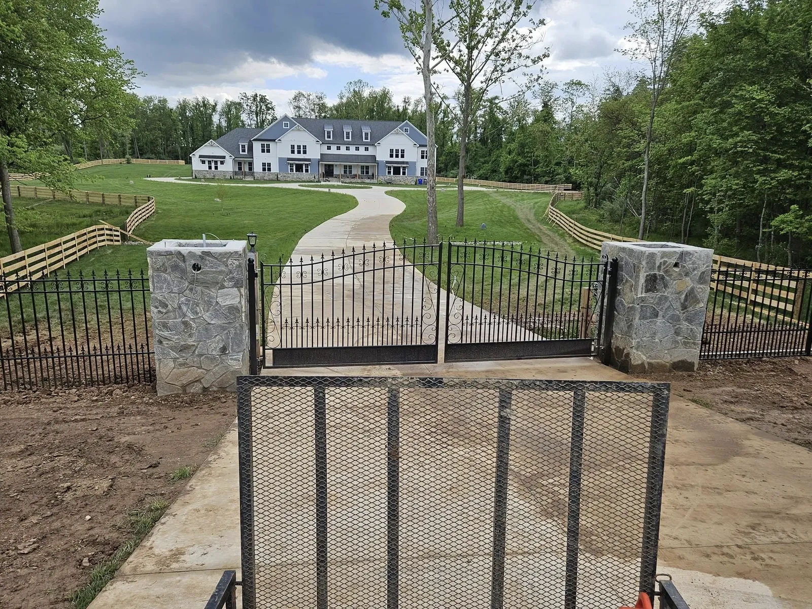 gated-entrance-to-house-on-rolling-landscape-in-va