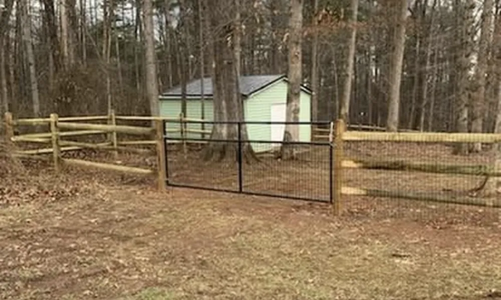 wood-fence-installation-in-winchester-with-gate-and-shed-background